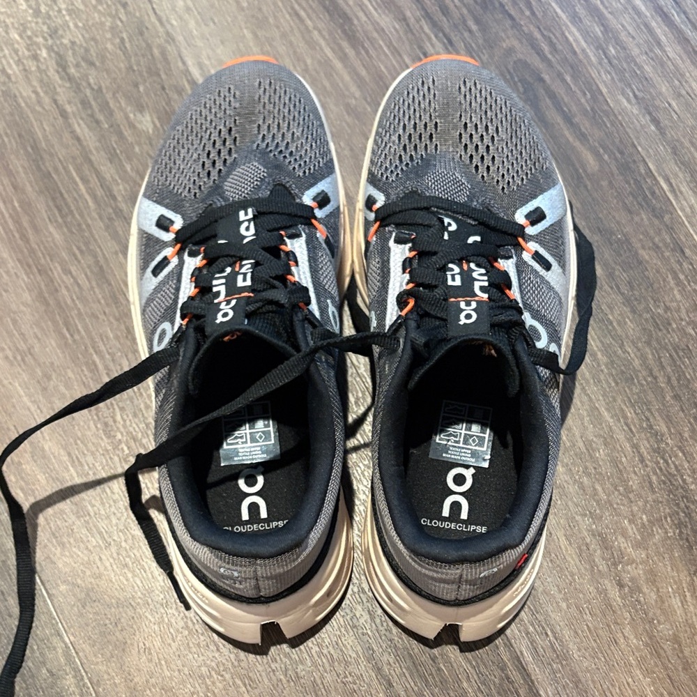 On Running Cloudclipse Shoes in Gray and Black with Orange Highlights